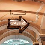 a casino sign hanging from the ceiling of a building